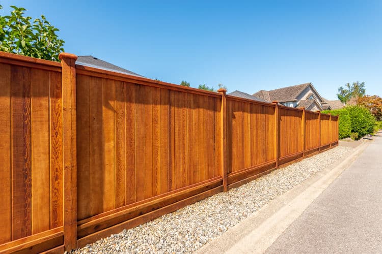 Fence built from wood. Outdoor landscape. Security and privacy c